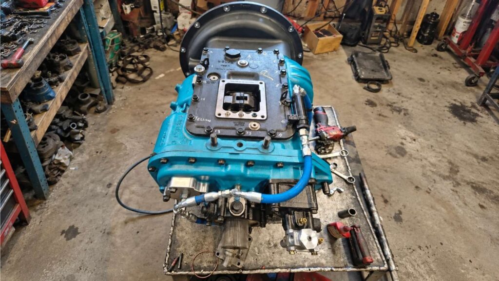 Custom Semi-Truck Race Transmission with Blue Housing on a Workshop Table
