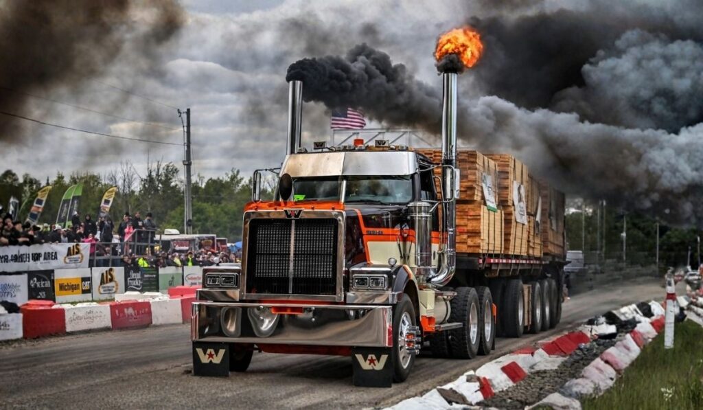 Loaded Semi-Truck Pulling a Heavy Trailer During a Truck Racing Competition